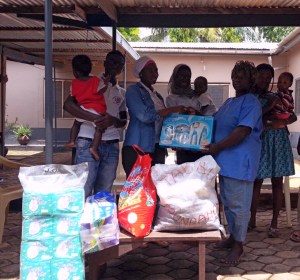 Our Executive Director presenting the Items  to the nanny on duty at the home