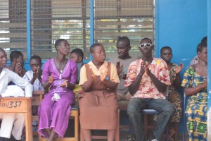 some Yumba pupils applauding after a welcome  speech by their head mistress